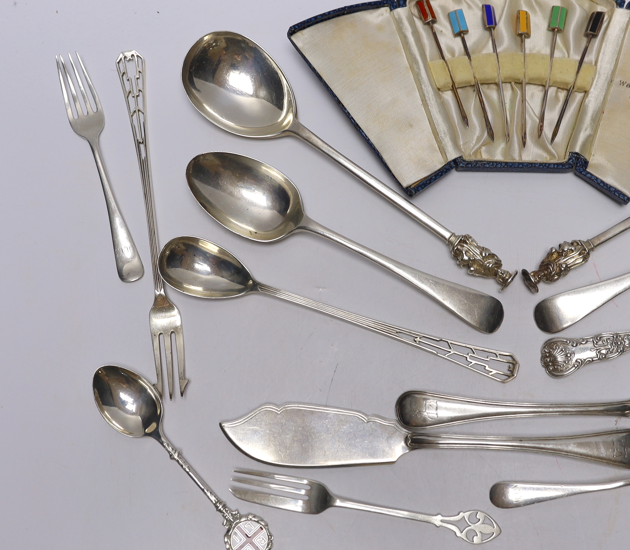 A pair of Edwardian silver apostles spoons, Josiah Williams & Co, London, 1902, 19.5cm and a small quantity of assorted silver flatware including pair of Victorian butter knives and a case of six silver and enamel cockta